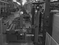 Macchina di carico-scarico carrelli stoccaggio a rulli